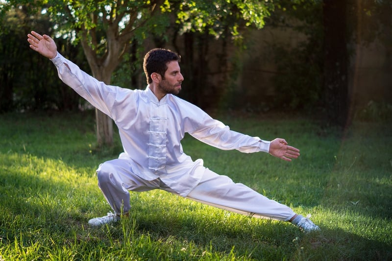 Elderly man practicing Tai Chi